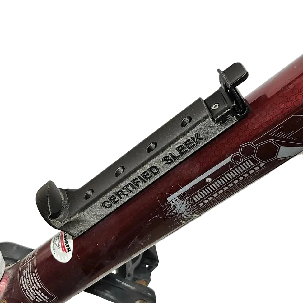 Close-up of a bicycle's chain mechanism with 'Certified Sleek' branding on a white background